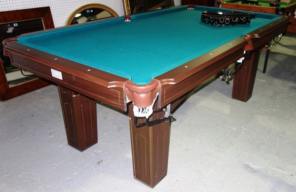 A 20th century snooker/pool table and accessories.