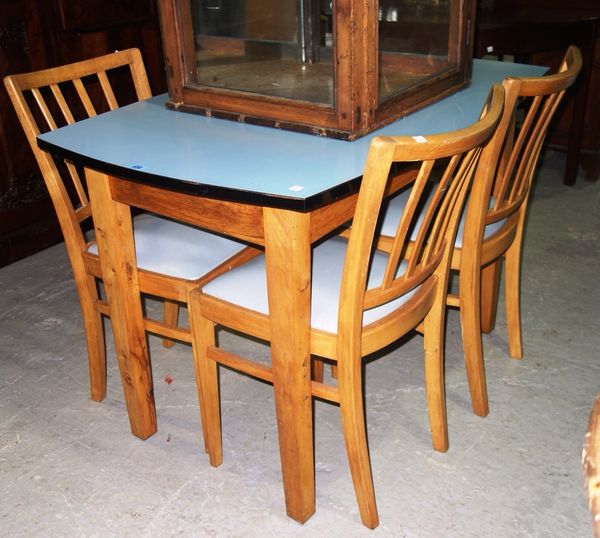 A 20th century pine formica topped dining table and four chairs.