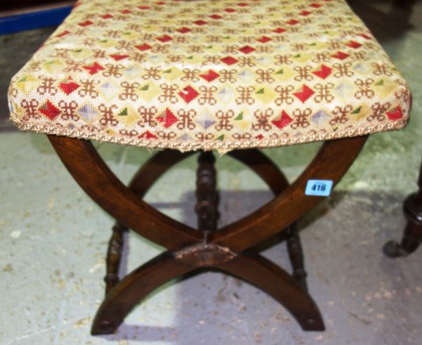 An early 19th century mahogany 'X' framed stool.