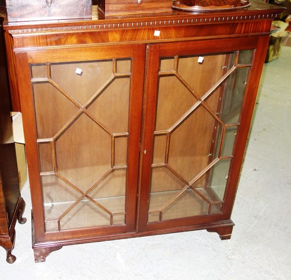 A 20th century mahogany astragal glazed bookcase.