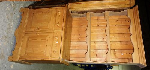 A 20th century pine dresser, with three tier plate rack over two drawers and pair of cupboards.
