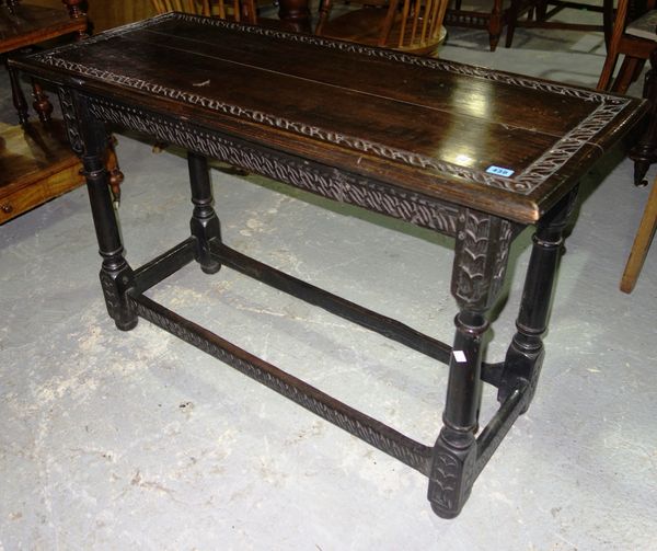 An early 19th century oak rectangular side table with perimeter stretcher.