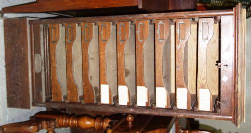 An early 20th century oak tambour fronted filing cabinet.