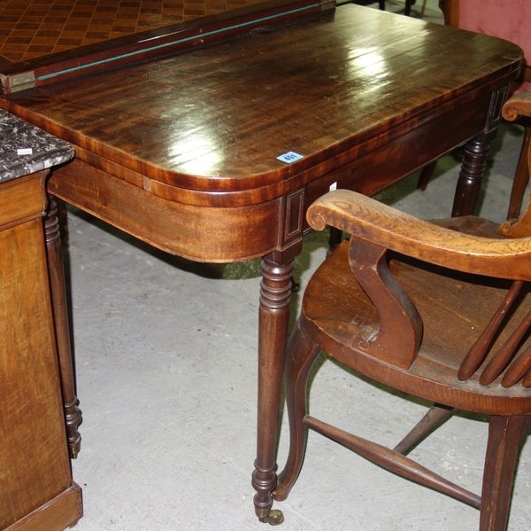 A George III mahogany fold over games table.