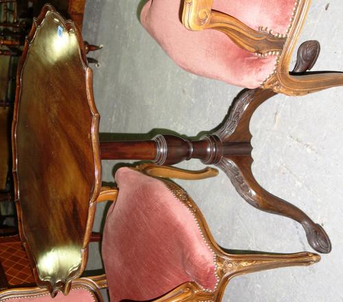 A George III mahogany tripod table with dished pie crust top.