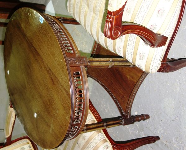 An Edwardian mahogany oval topped two tier occasional table.