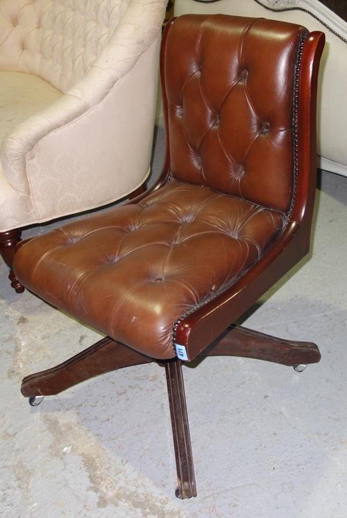 A 20th century mahogany and leather office chair.
