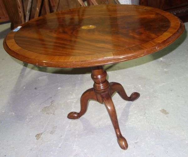 A 20th century mahogany oval tilt top table occasional table.