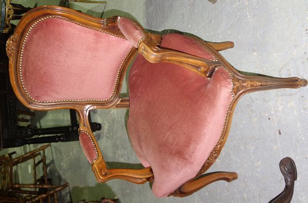A pair of 20th century stained beech upholstered fauteuils.