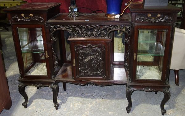 A 19th century carved mahogany glazed side cabinet.