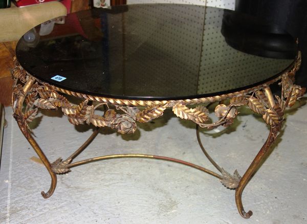 A 20th century French gilt metal coffee table with glass top.