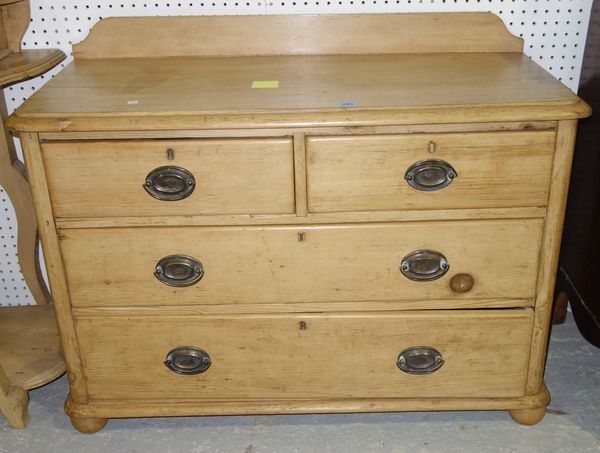 A Victorian pine small chest of  two short and two long drawers.