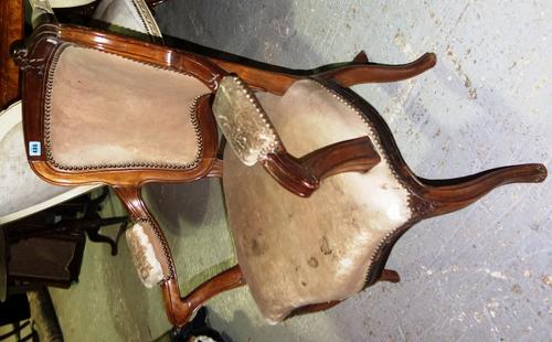 A 19th century French armchair with unusual additional back leg.