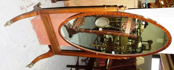 A George II style mahogany oval cheval mirror.