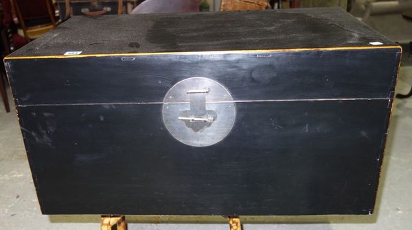 A 20th century Chinese small black laquer trunk with carrying handles.