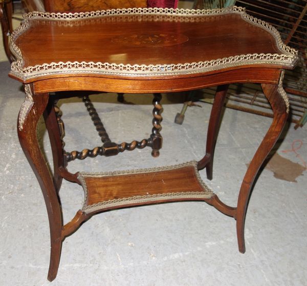 An Edwardian mahogany inlaid two tier table.