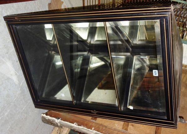 A 20th century ebonised corner display cabinet.