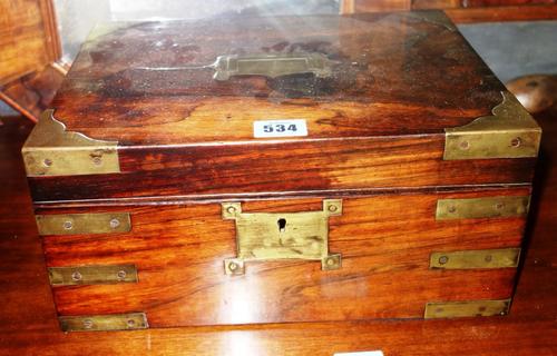 A 19th century rosewood and brass bound sewing box.