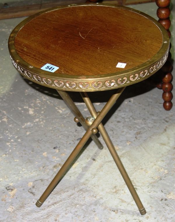 A small brass and oak tripod side table.