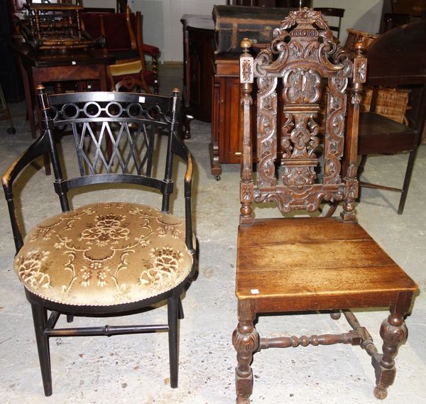 A 19th century carved oak side chair and an ebonised elbow chair. (2)