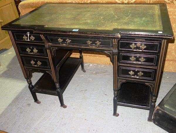 A 19th century ebonised kneehole desk.