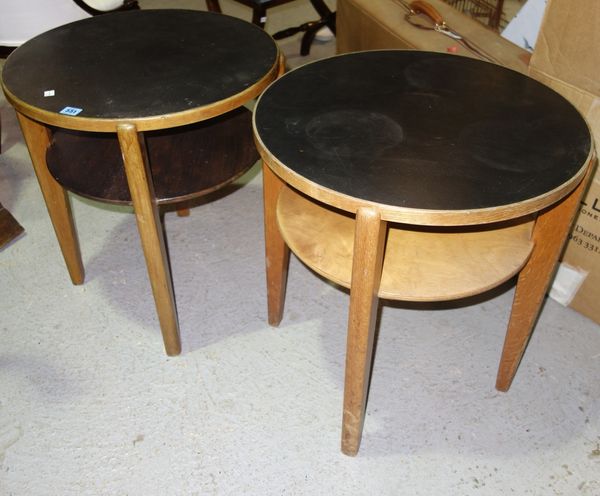 A pair of 1950s oak circular tables. (2)