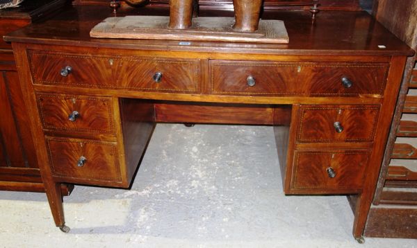 An Edwardian mahogany dressing table with triptych mirror.
