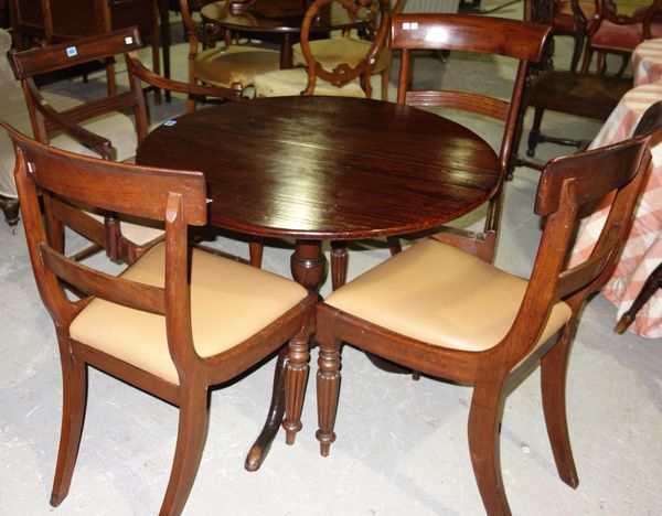 A matched set of four bar back dining chairs, to include one carver, (4).
