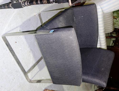 A 20th century chrome and black upholstered chair.