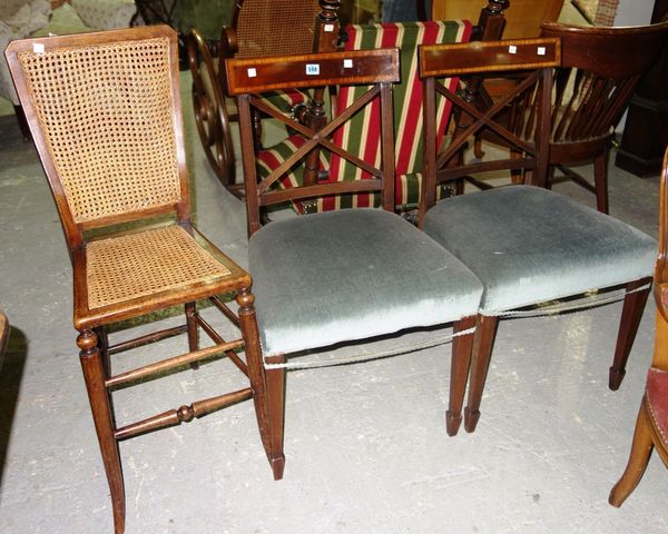 A pair of mahogany 'X' framed back dining chairs and a cane seated single chair.