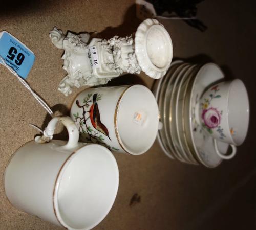 Two Amstel porcelain coffee cans and six saucers, circa 1800, each painted with a bird inside gilt line rims, black painted mark, (a.f); also a Hague