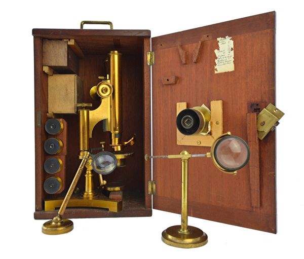 An R. J. Beck binocular microscope, late 19th century, No. 10880, with rack and pinion focusing, four eye pieces, four objectives, two adjustable bull