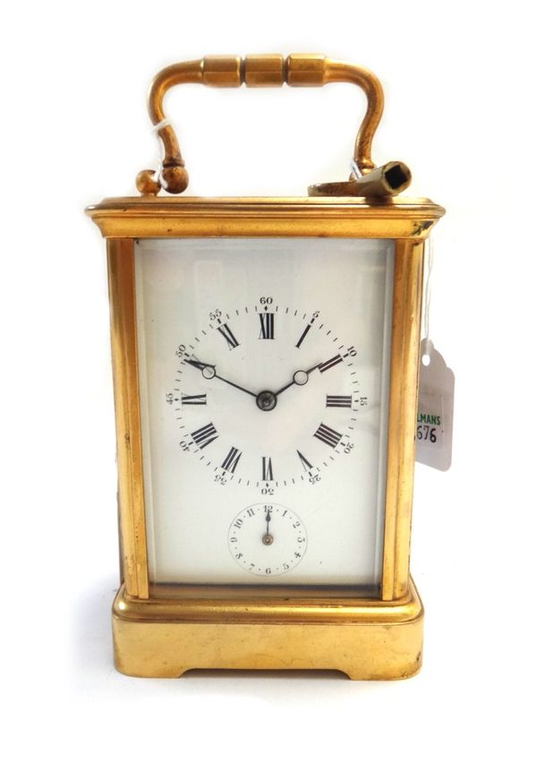 A French gilt brass cased carriage clock, early 20th century, the white enamel dial with subsidiary alarm dial on a plinth base with single train stri