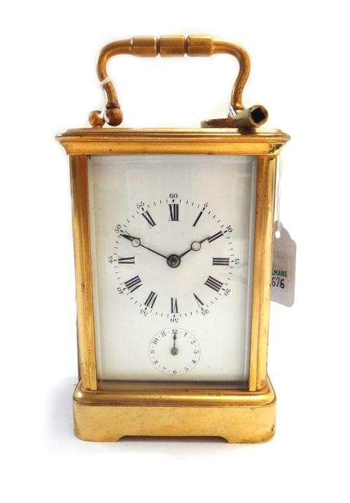 A French gilt brass cased carriage clock, early 20th century, the white enamel dial with subsidiary alarm dial on a plinth base with single train stri