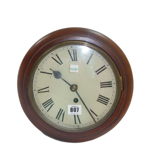 A mahogany cased 8 day dial clock, early 20th century, with an 8 inch painted tin dial and a single fusee movement, 28cms diameter (key and pendulum).