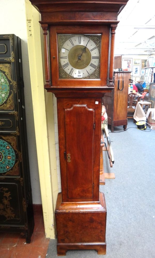 An early 18th century fruitwood cased 30 hour longcase clock with plain dial flanked by pillared supports over a waisted trunk, 192cm high. (Pendulum)