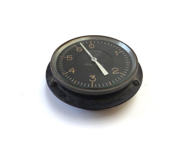 A German altimeter, World War Two period, in a circular ebonised metal case, the dial detailed 'Compensiert no.30039 Hohe in KM', the dial 10cm diamet