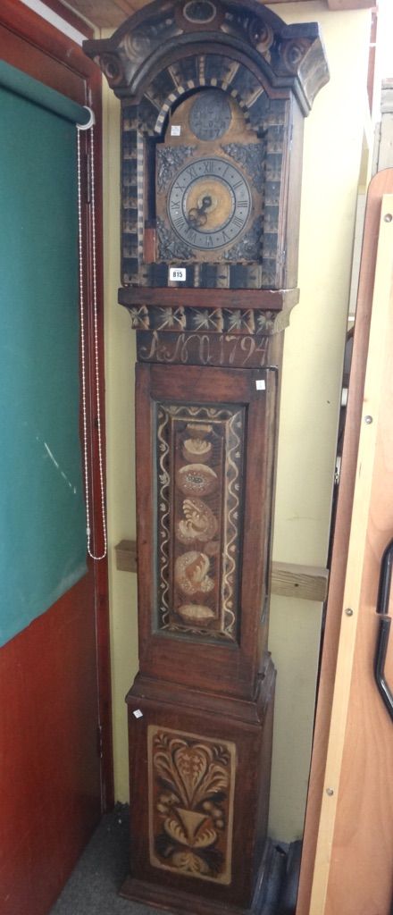 A late 18th century Swedish painted longcase clock, dated 1794 to the case and 1787 to the dial, the plain case with arched hood and waisted trunk, wi