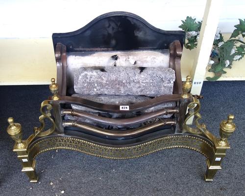 An 18th century style steel and brass fire basket, with pierced serpentine front and urn finials, 78cm wide