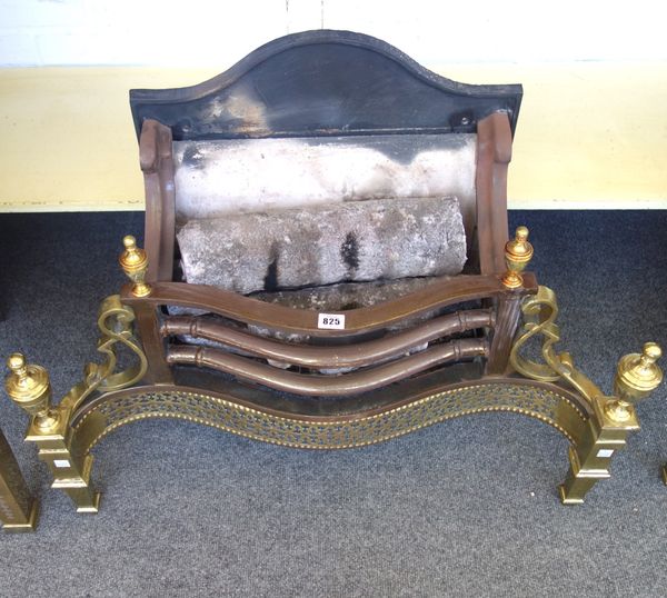 An 18th century style steel and brass fire basket, with pierced serpentine front and urn finials, 78cm wide.