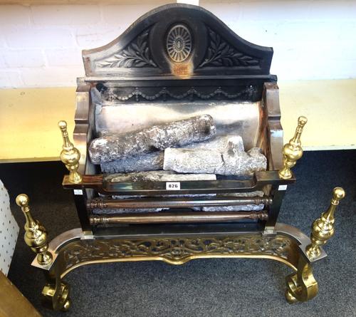An 18th century style steel and brass fire basket, with pierced serpentine front and turned finials, 72cm wide.