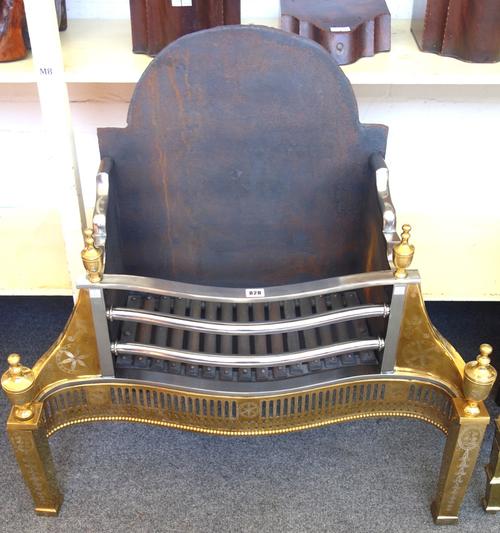 An 18th century style steel and brass fire basket, with pierced serpentine front and urn finials, 87cm wide.