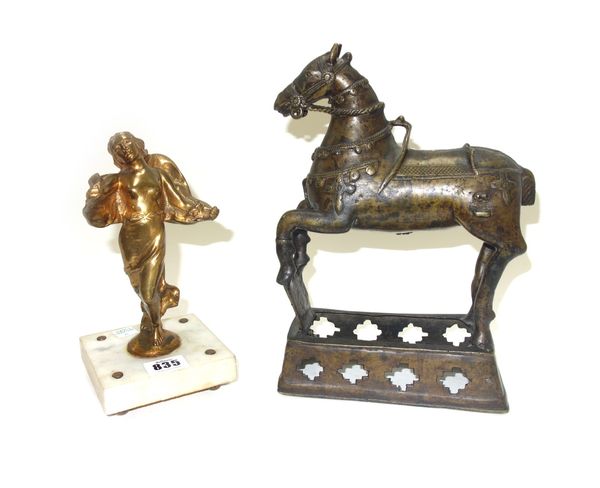 A gilt bronze figure of a 'Winged Victory', possibly a car mascot, raised on a marble plinth, 20.5cm high, and an Indian brass model of a horse, 26.5c