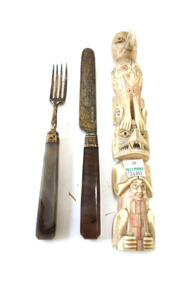 A North American Inuit carved bone totem, early 20th century, 22.5cm high, a George III Scottish knife and fork in silver gilt with agate handles, hal