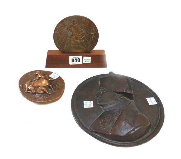 A bronze 'Christopher Award', dated 1958, on a wooden stand, 10cm diameter, together with a bronze circular plaque relief cast with a bust of Napoleon