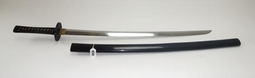 A Japanese katana, late 19th century, with polished steel blade 69.5cm, unsigned tang, shaped iron tsuba and a cord bound fish skin handle in an eboni