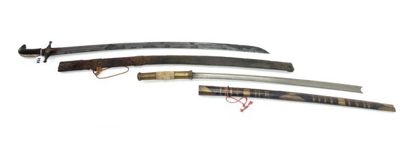 An Indian Talwar, 19th century, with curved engraved steel blade 82cm and a two piece horn handle in a wooden scabbard and a Burmese Dha. (2)