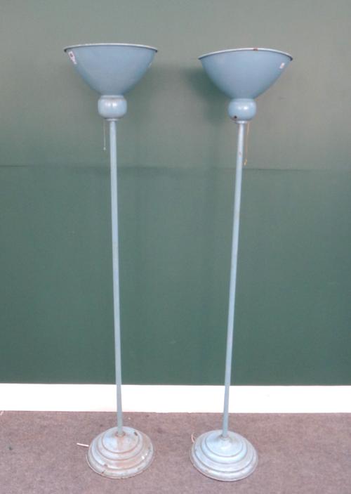 A pair of blue enamelled metal uplighters, mid-20th century, on circular and stepped bases (a.f), 165cm high. (2)