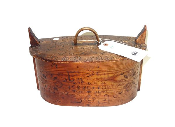 A Swedish steamed bentwood food box and cover, 19th century, of oval form with carved decoration and dated 1887, 32.5cm wide, and a late Victorian ova
