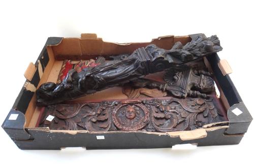 An 18th century carved oak figural corbel 61cm; a 19th century carved oak surmount detailed with a central foliate panel flanked by two rampant lions